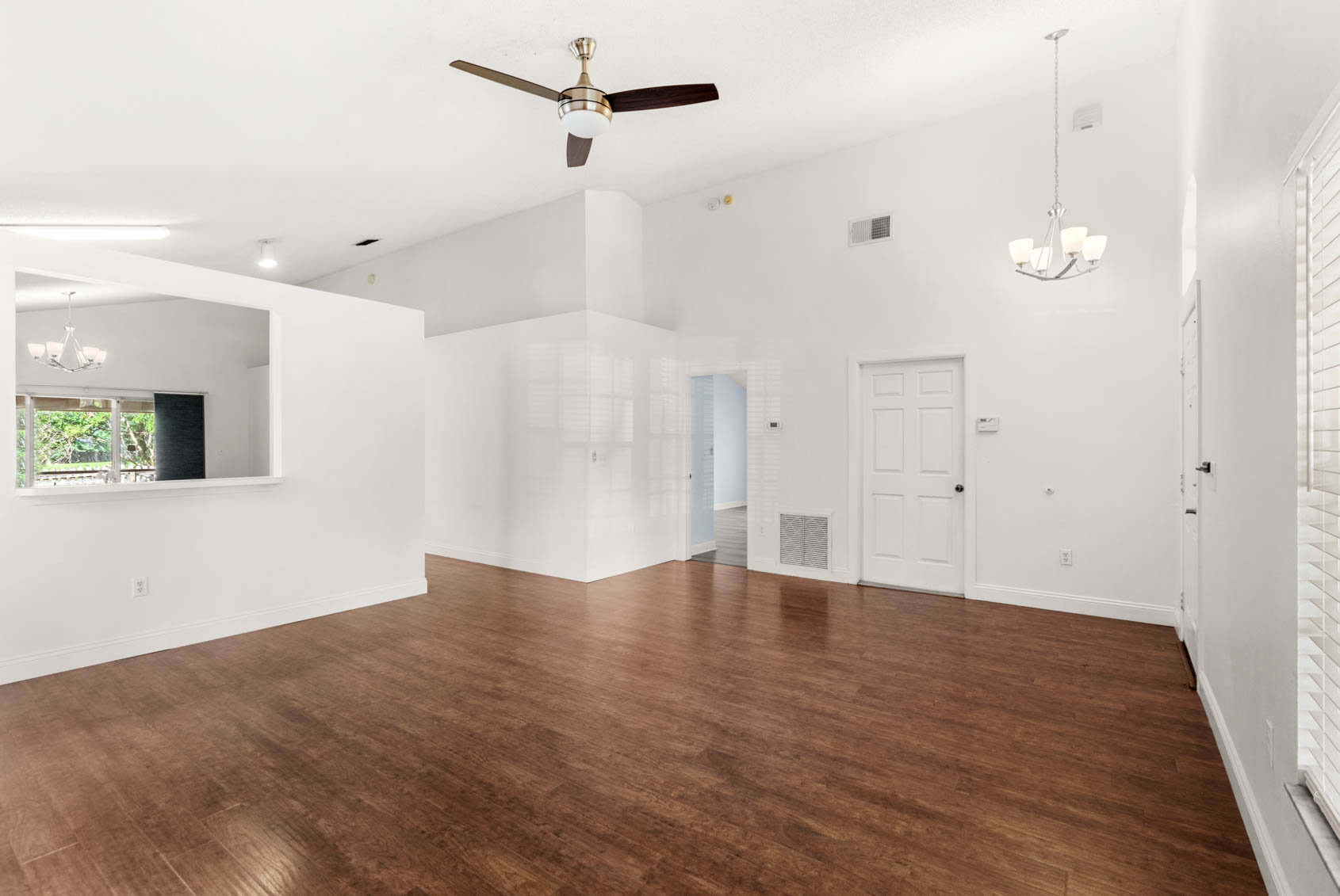 living room with wooden floors and white walls